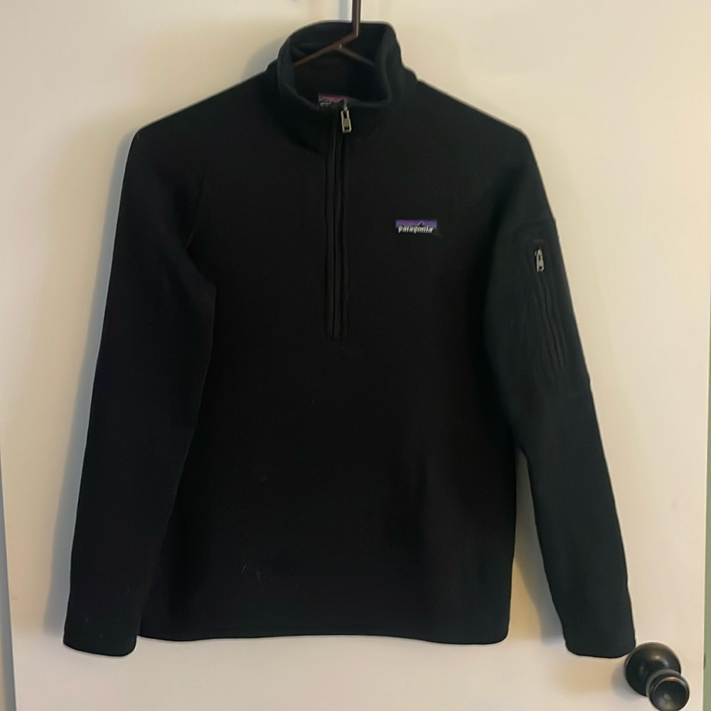 Black size small Patagonia quarter zip with pocket on sleeve